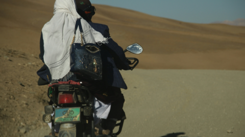 Afghan woman on motorcycle