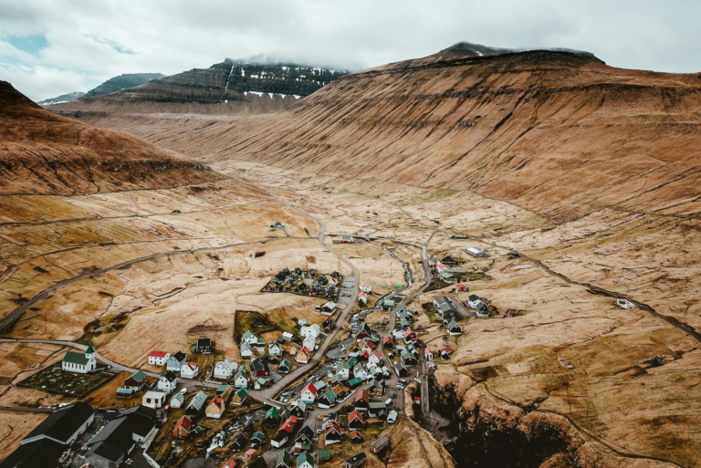 Remote village in valley surrounded by mountains